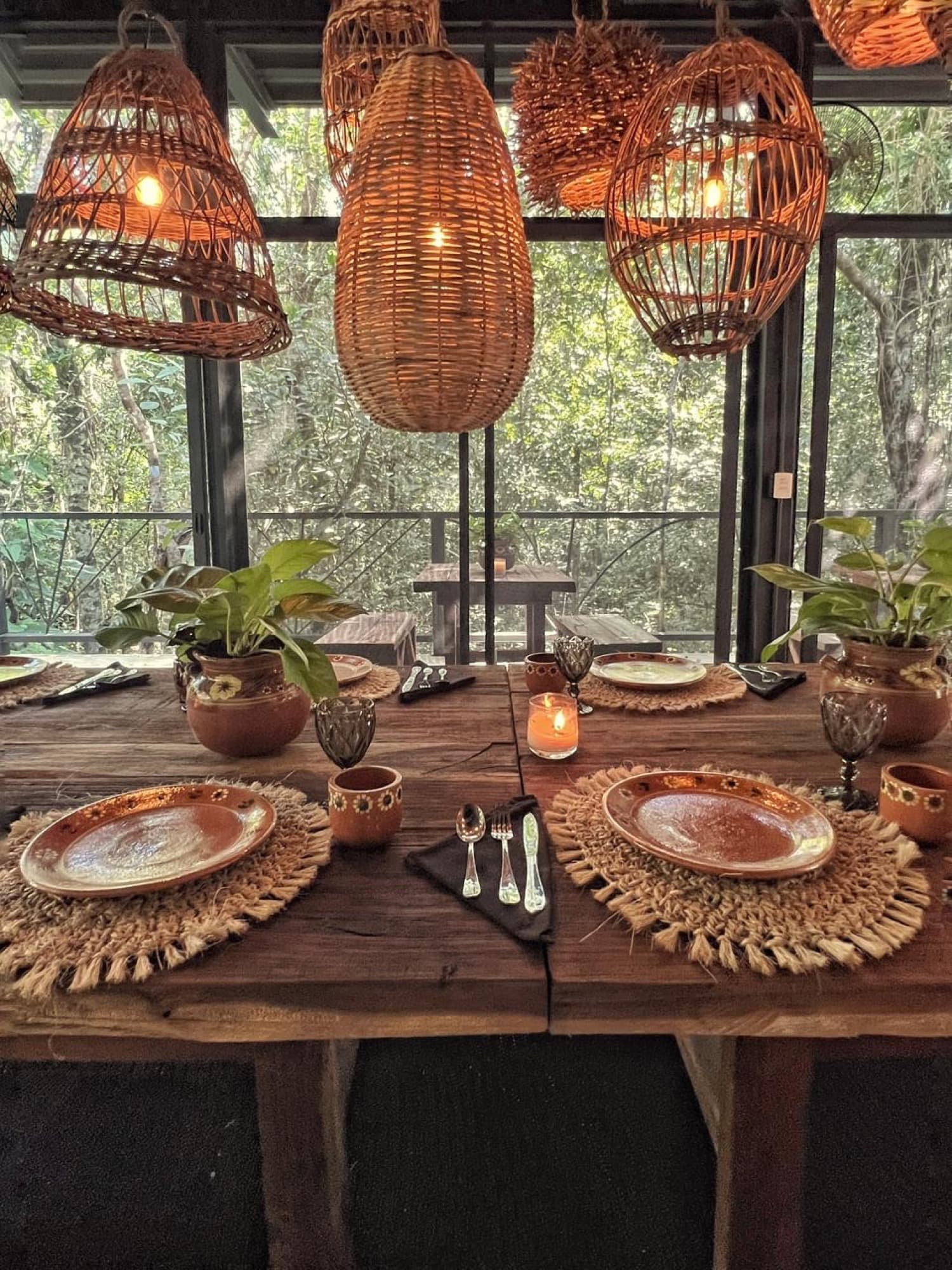 The head of the table set for two, baskets glowing above