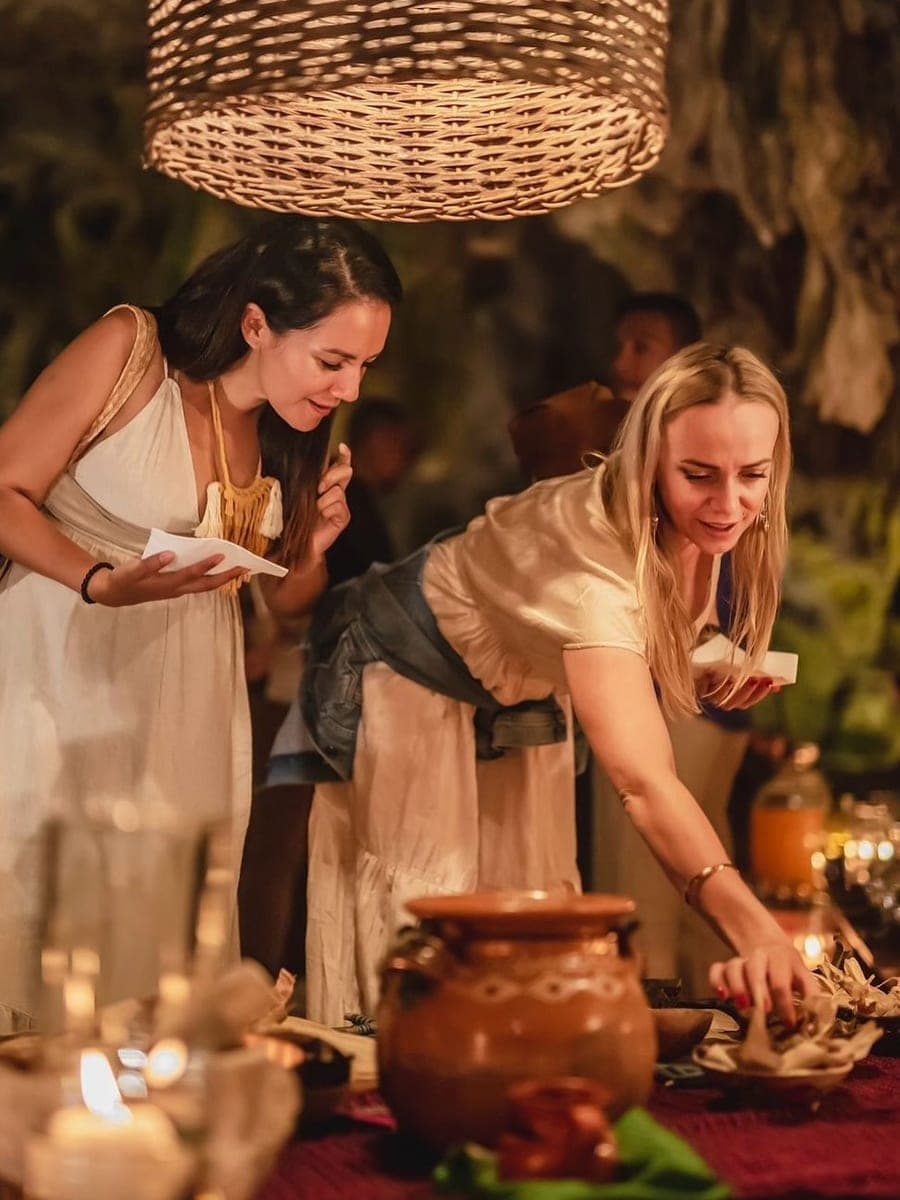 Ceremonial cacao poured from a clay pot at the altar