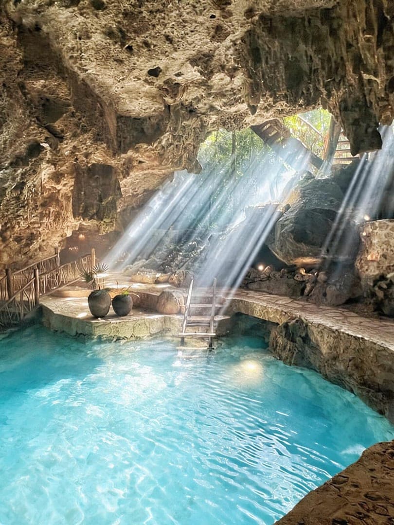 A guest floating on the surface of the cenote